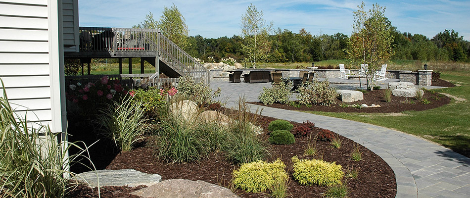 Mulch added to landscape beds throughout property in Haslett, MI.
